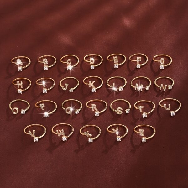 Adjustable Copper Ring With Four-claw Round Zirconia, Featuring The 26 English Letters Of Fashion Trend.