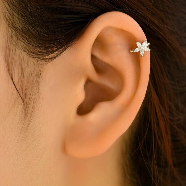 A Delicate And Simple Zirconia Flower Clip-on Earring For Ladies, A Gorgeous Jewelry Accessory.